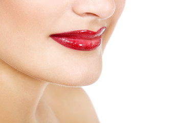 Naklejka premium Beautiful lips of young gorgeous fresh woman with vivid red lips