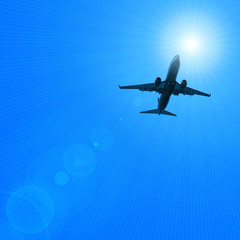 airplane flying over the blue skies and sun with background