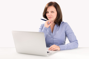 Business woman is sitting in front of a laptop