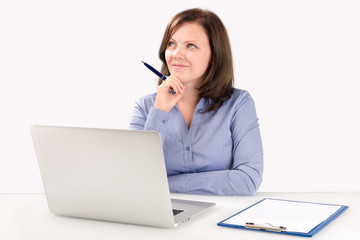 Business woman is sitting in front of a laptop