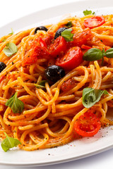 Pasta with meat, tomato sauce, parmesan and vegetables