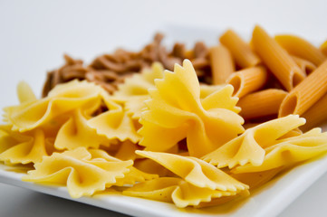 different organic pasta types in a bowl