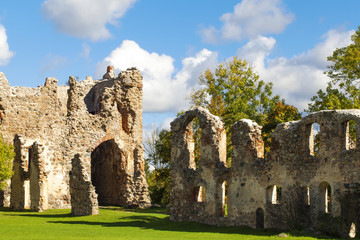 Fototapeta na wymiar Old castle ruins on a blue sky background