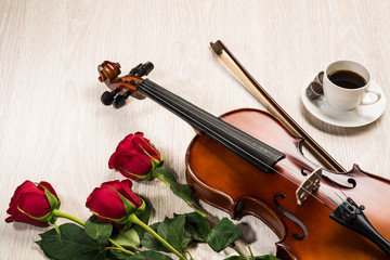 Fototapeta premium Violin, rose, coffee and music books