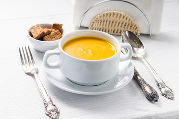 Pumpkin soup on served table