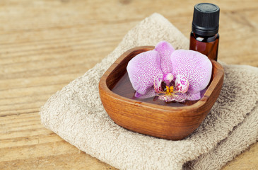 Spa concept: setting  with towels and orchid
