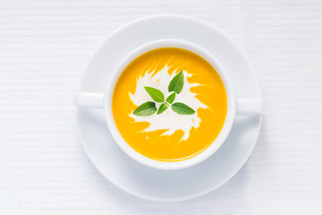 Pumpkin soup on served table. Top view