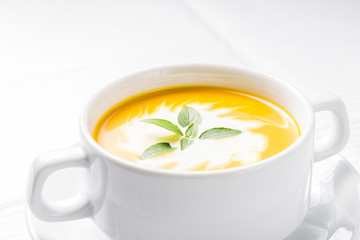 Pumpkin soup on served table