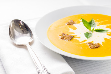 Pumpkin soup on served table