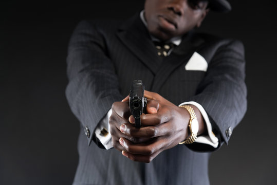 Retro African American Mafia Man Wearing Striped Suit And Tie An