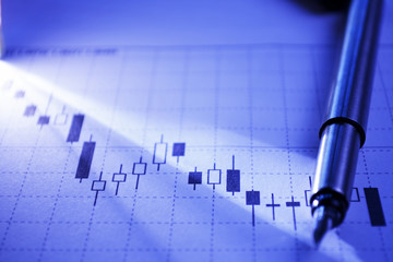 Fountain pen on a business graph