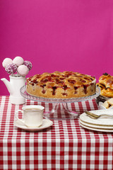 Strawberry pie on cake stand, fuchsia background