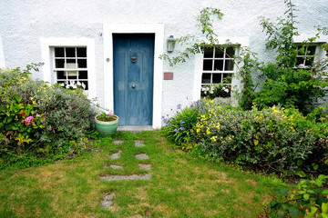 Old, traditional house and the garden