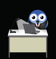 Employee working late at his desk by lamplight