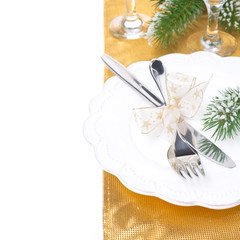 Christmas table place setting in golden tones, isolated
