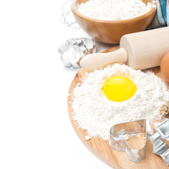 ingredients for baking cookies - flour, egg and baking forms
