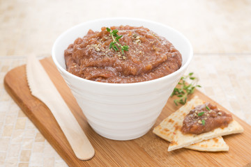 pate of roasted eggplant and tomatoes on a wooden board