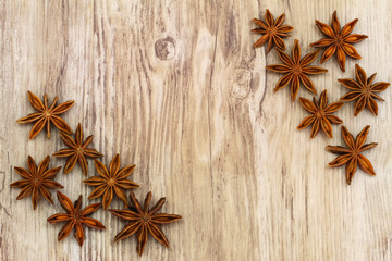 Star anise on wooden surface with copy space