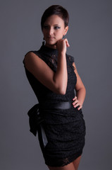Fototapeta premium Beautiful woman in a black elegant evening dress