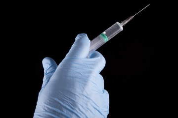 Doctor Holding a Syringe