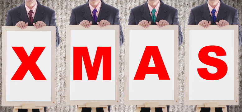 Businessman show X MAS text for welcome chritmasday