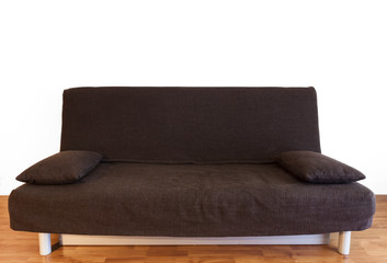 Brown couch in studio flat