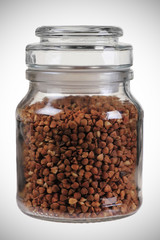 closed glass jar with buck-wheat