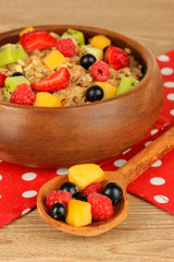 Oatmeal with fruits on table close-up
