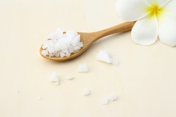  Sea salt on wooden spoon closeup