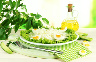 Delicious salad with eggs, cabbage and cucumbers on wooden