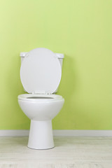 White toilet bowl in a bathroom