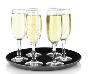 Many glasses of champagne on the tray, isolated on white