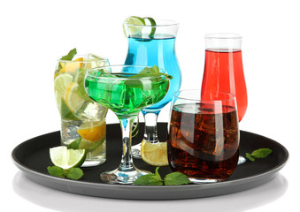 Many glasses of cocktails on tray, isolated on white