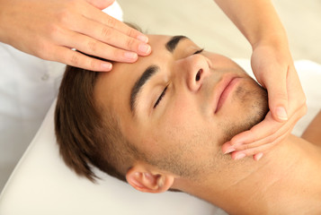 Fototapeta na wymiar Man having head massage close up