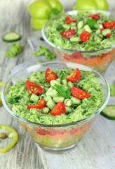 Tasty salad with fresh vegetables on wooden table