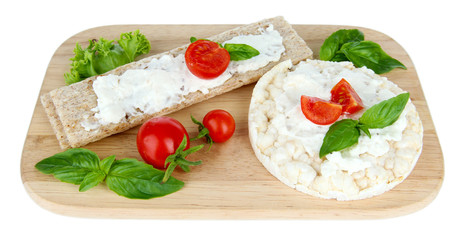 Tasty crispbreads with vegetables, isolated on white