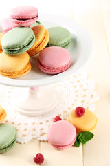 Gentle macaroons in vase on table close-up