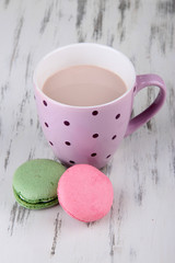 Cocoa drink, macaroni and cocoa beans on wooden background