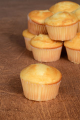 Vanilla cupcakes on wood