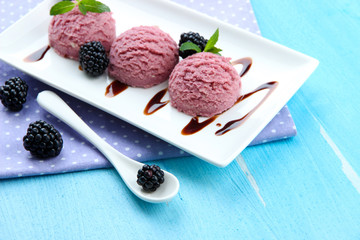 Delicious ice cream on plate on table close-up