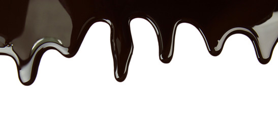 Melted chocolate dripping on white background