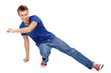 Handsome young man dancing isolated on white