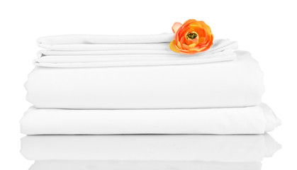 Stack of clean bedding sheets isolated on white