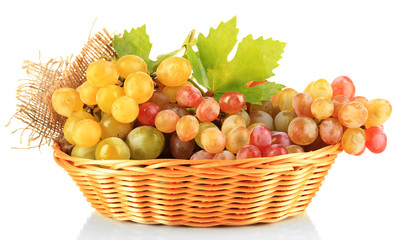 Ripe sweet grape in basket, isolated on white