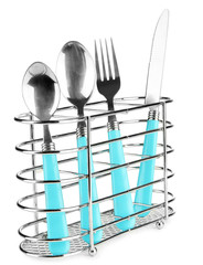 Knife, fork and spoons in metal stand isolated on white