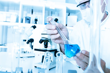 scientist working in the lab a with liquid