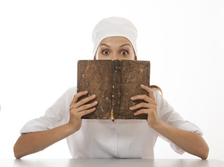 Woman doctor or nurse reading old book