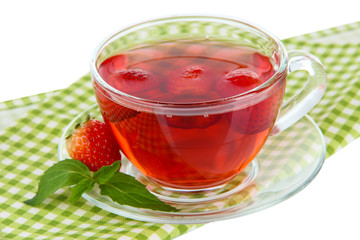 Delicious strawberry tea on table on white background