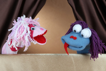 Puppet show on brown background