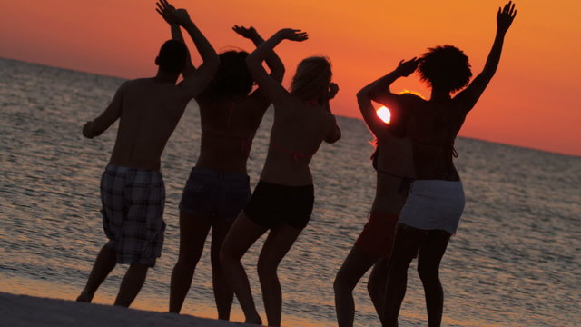 Teenagers Silhouette Dancing Beach Sunset